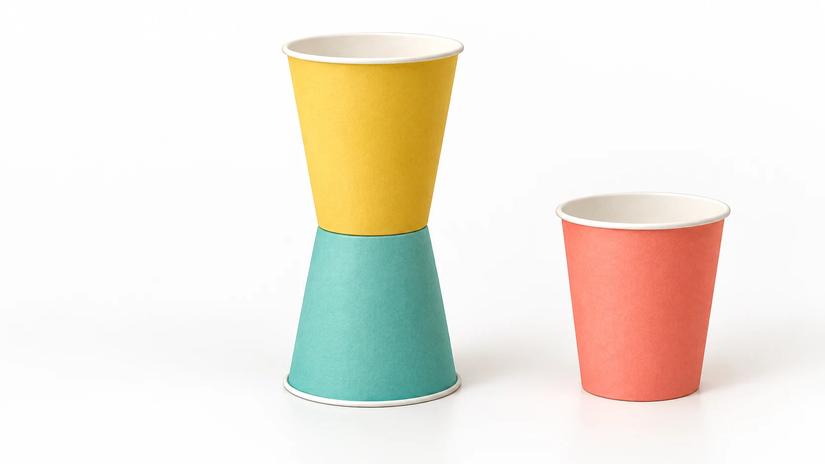 Two paper cups touching at their closed bottoms: the lower cup upside down and the upper cup upright, with one spare cup beside them